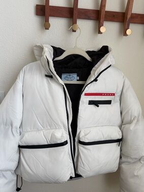 Prada White Down Puffer Jacket with Black Trim and Red Logo Stripe